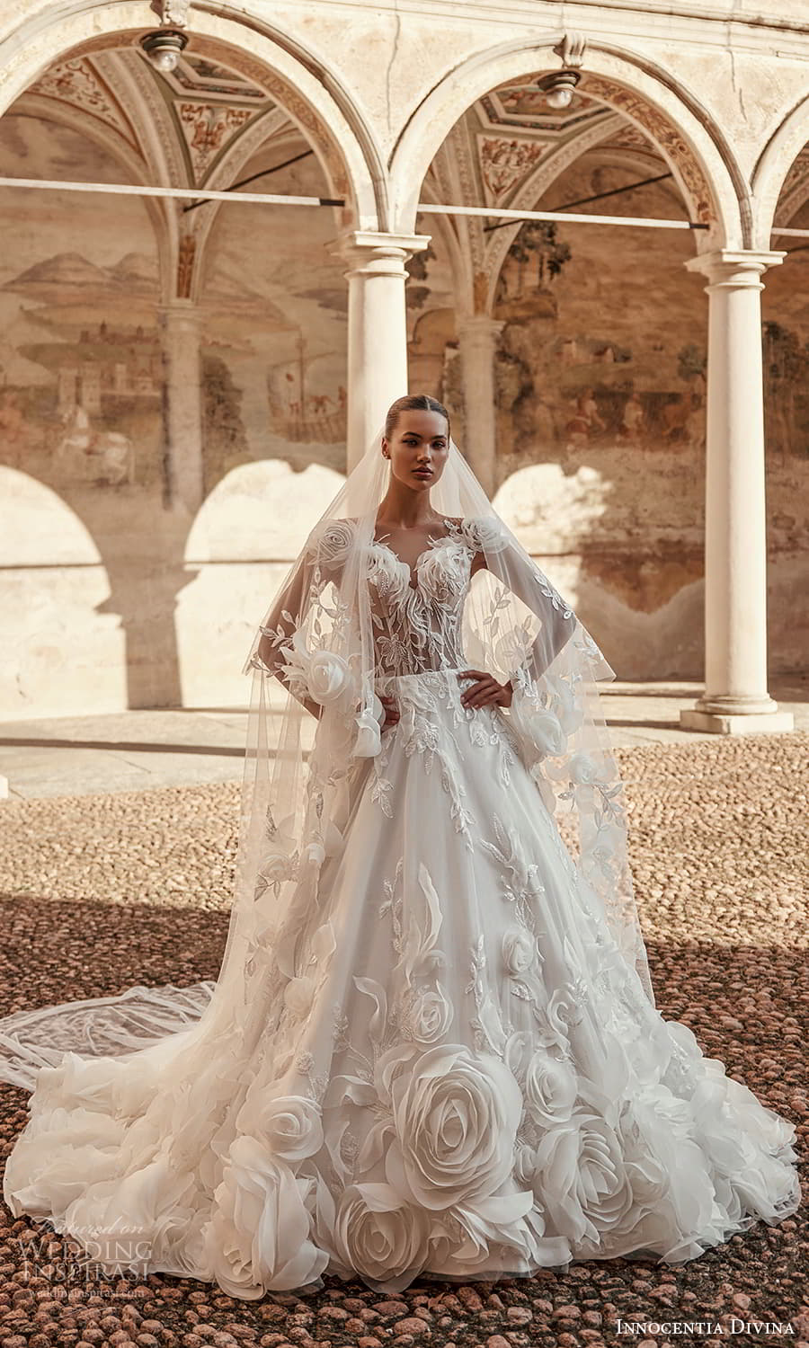 innocentia-divina-fall-2024-bridal-cap-sleeve-v-neckline-fully-embellished-a-line-ball-gown-wedding-dress-chapel-train-.jpg