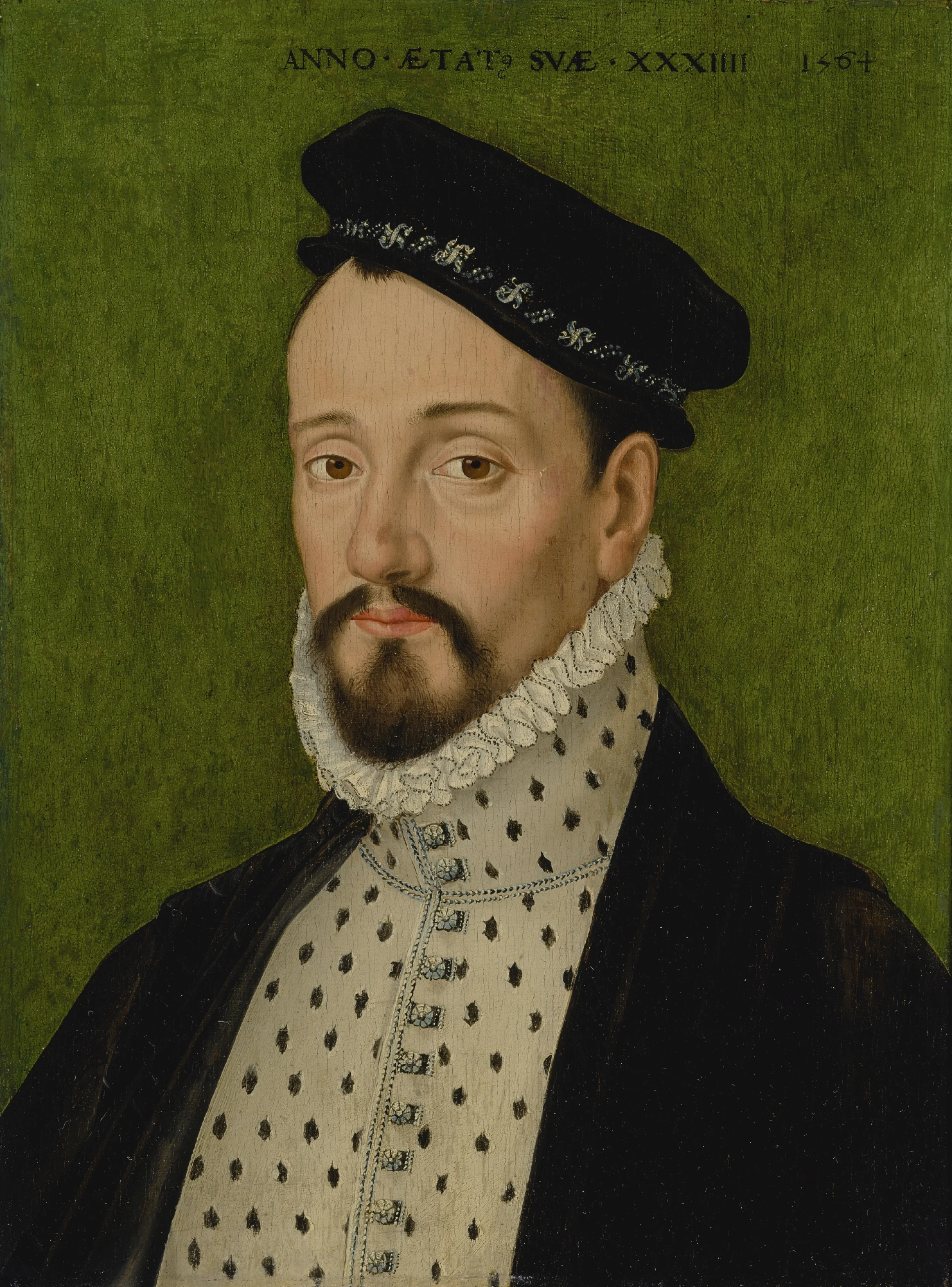 14 Portrait of a bearded young man at the age of 34, bust length, wearing a black cap.webp